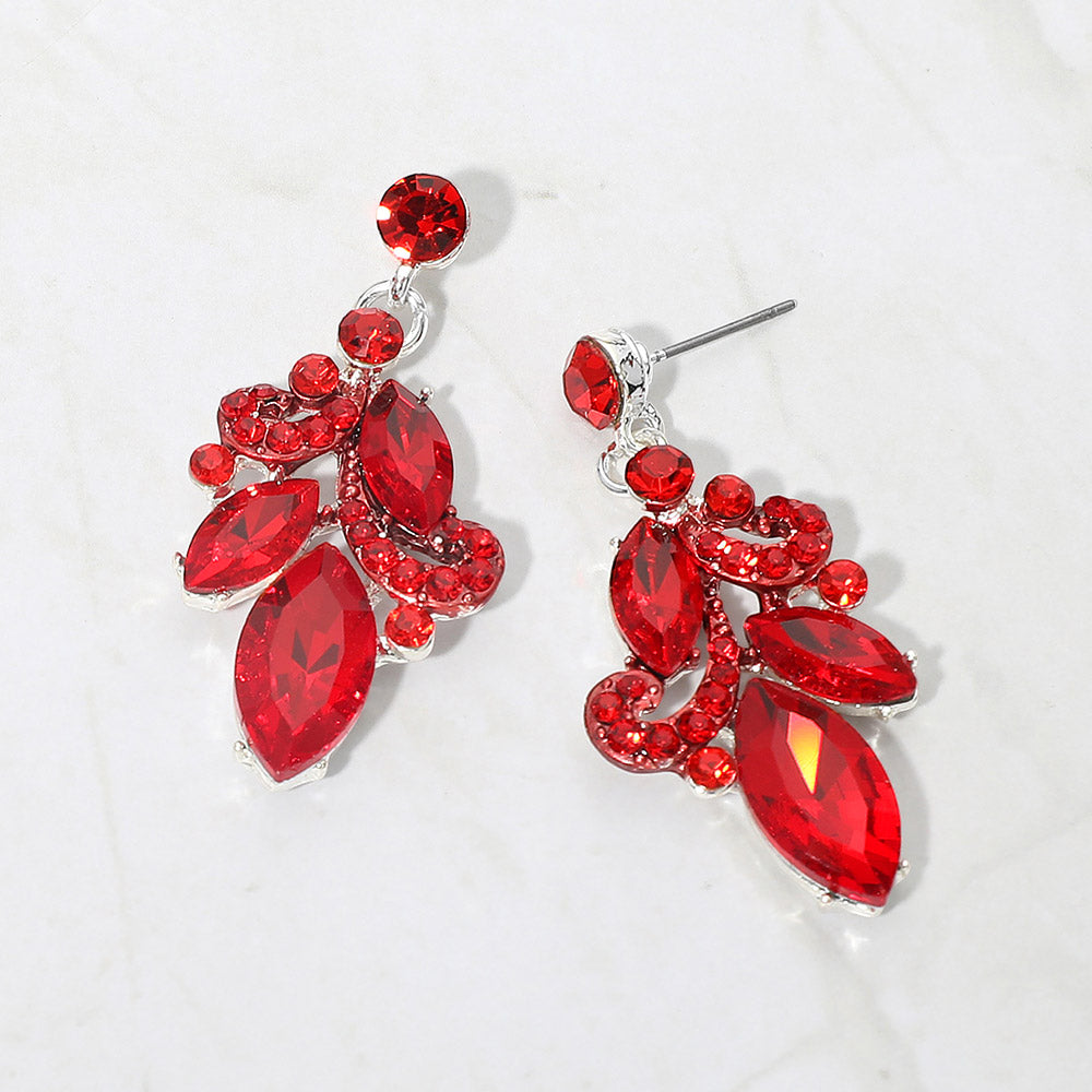 Red marquise stone cluster prom, beauty walk and formal drop earrings on silver on white background