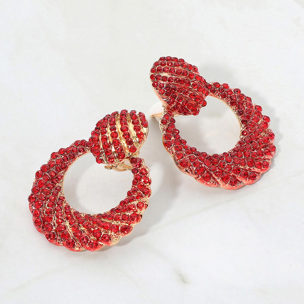 Red rhinestone pavé door knocker clip-on earrings on gold on a white background
