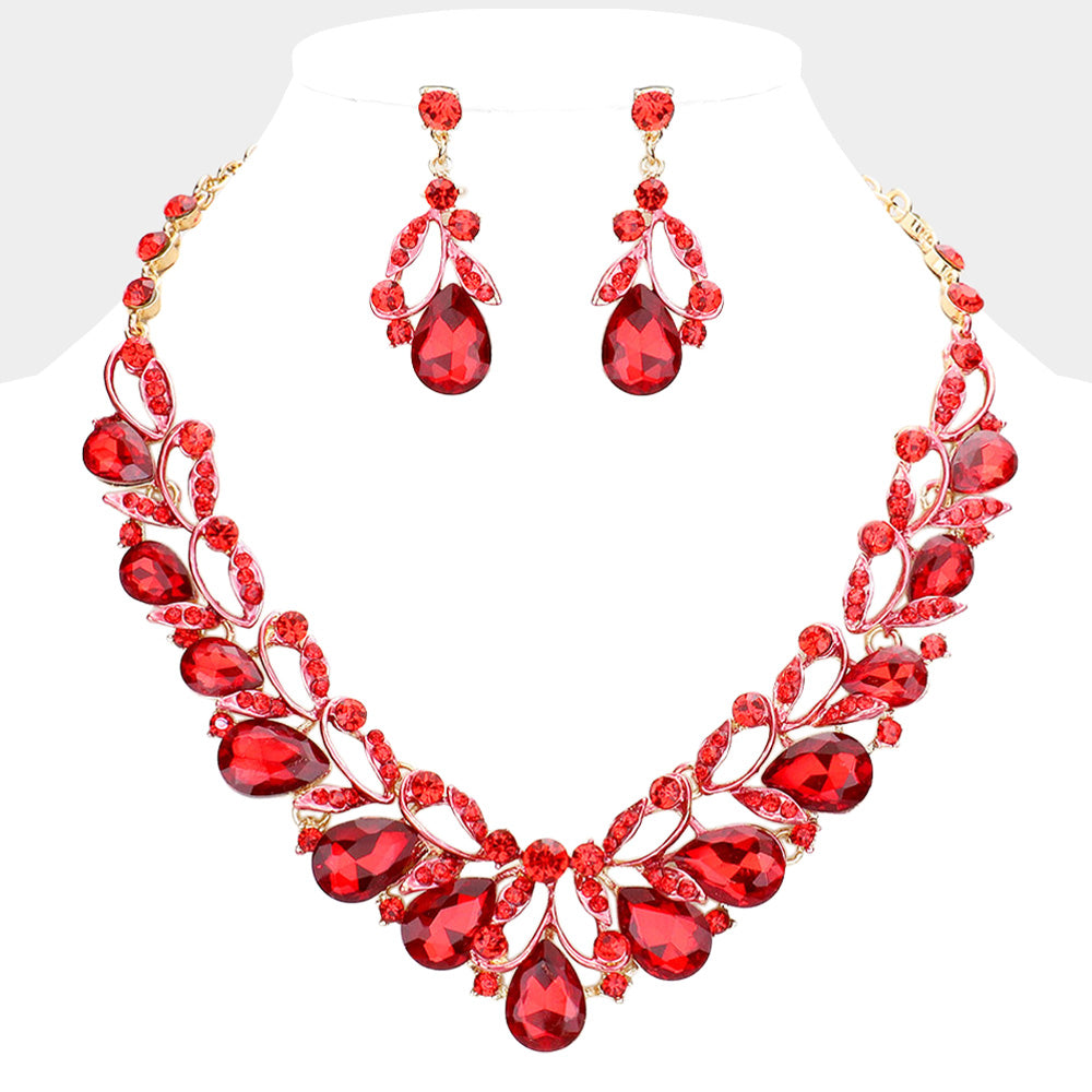 Red teardrop leaf crystal statement necklace set with matching earrings in a gold setting on a white background