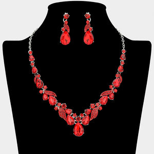 Red teardrop leaf prom necklace set on silver with matching earrings displayed on a black mannequin bust on a white background.