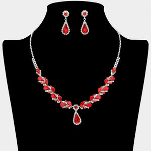 Red marquise pendant necklace set on silver with matching earrings for prom and evening wear on a black mannequin bust on a white background.