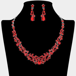 Red teardrop rhinestone cluster necklace set on silver with matching earrings for prom and formal wear. Shown here on a black mannequin bust.