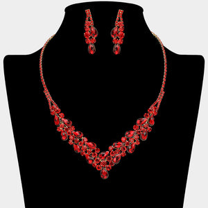 Red teardrop rhinestone necklace set with V-shaped crystal design and matching earrings, all backed in Gold, for prom and formal wear. Shown on a black mannequin bust.  
