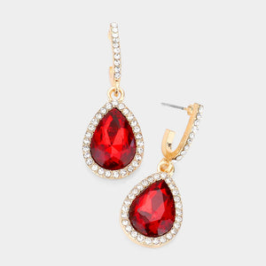 Red teardrop rhinestone trim dangle earrings on gold on white background