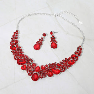 Red teardrop floral statement necklace set on silver displayed on white background