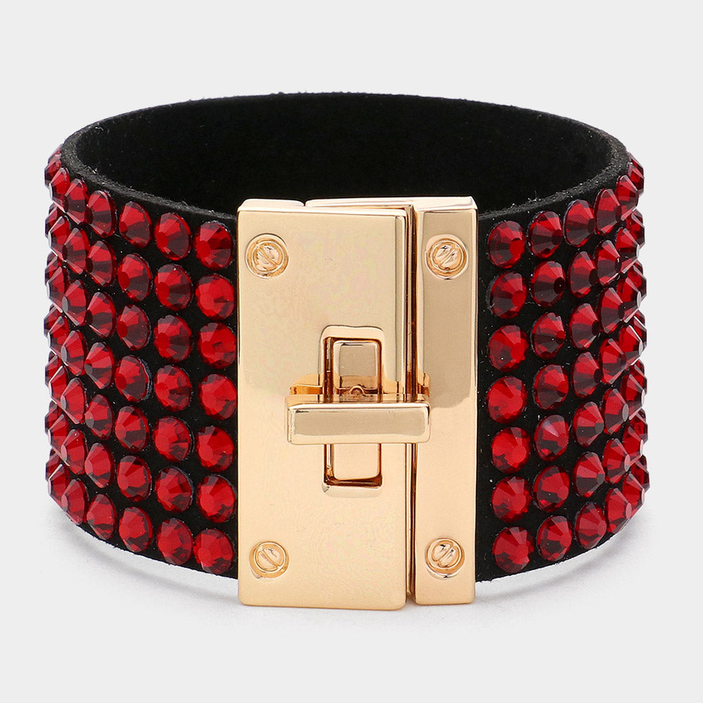 Red on black 7-row rhinestone bling studded bracelet with gold hardware on a white background