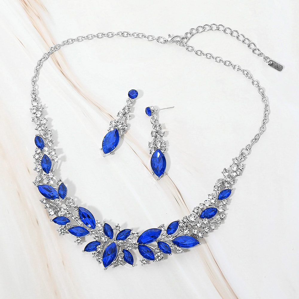 Royal Blue and clear marquise stone cluster prom and evening necklace set on silver on white marble background
