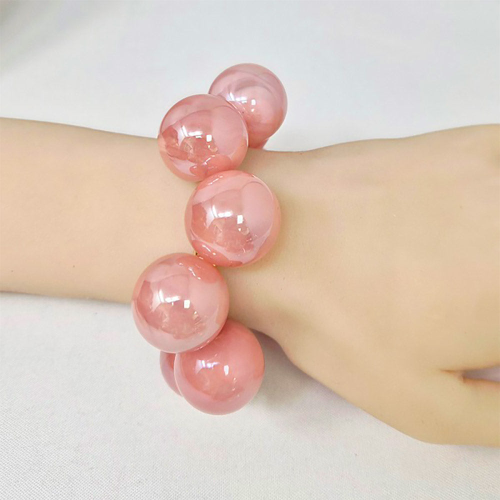 Chunky royal blue iridescent balls/spheres bracelet on a wrist