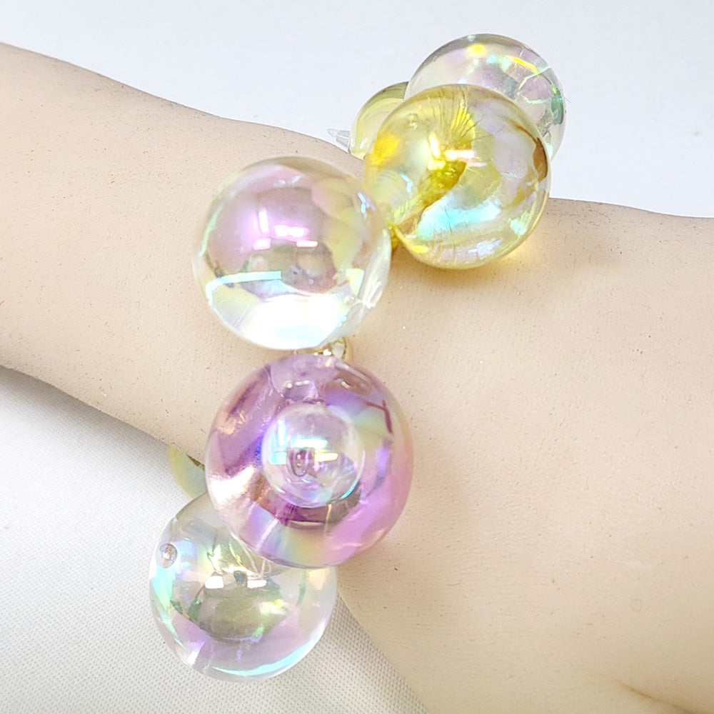 Chunky royal blue iridescent balls/spheres bracelet on a wrist