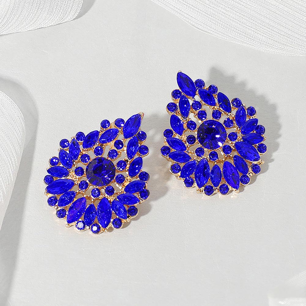 Sapphire royal blue marquise stone cluster teardrop earrings on gold on a white background