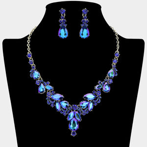 Sapphire AB rhinestone cluster necklace with teardrop gems and earrings on a black mannequin bust for pageant or prom