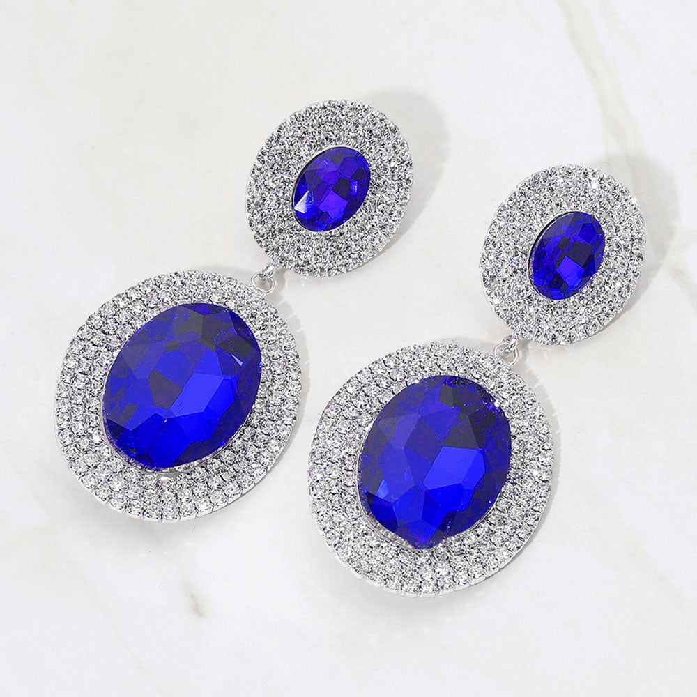 Sapphire Blue crystal double oval halos surrounded by rhinestones on silver on a white background — elegant 2.8" statement jewelry for weddings, prom, and evening glam.