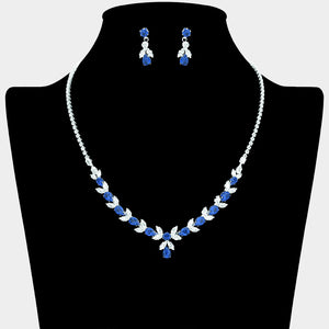 Sapphire and clear crystal marquise necklace set on silver with matching drop earrings displayed on a black jewelry bust.