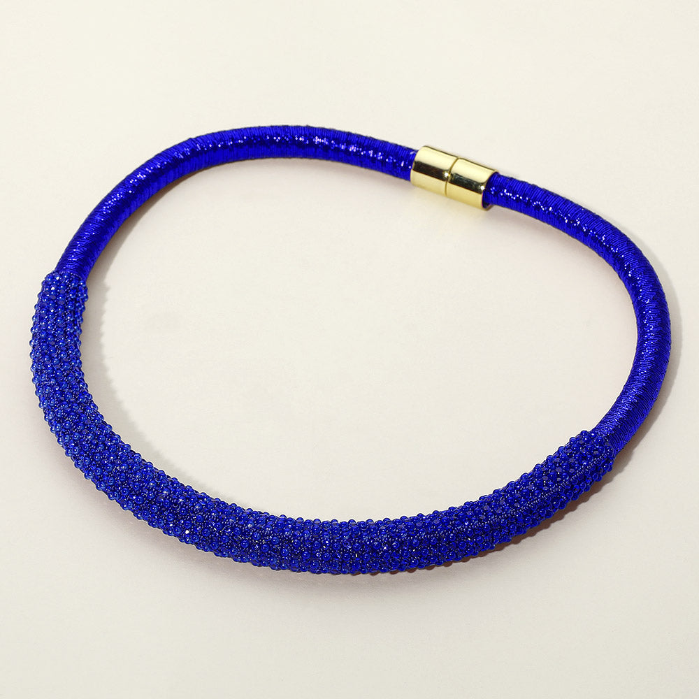 Sapphire Royal Blue crystal beaded magnetic choker necklace with a textured microbeaded front section, displayed on a light beige background.