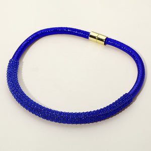 Sapphire Royal Blue crystal beaded magnetic choker necklace with a textured microbeaded front section, displayed on a light beige background.