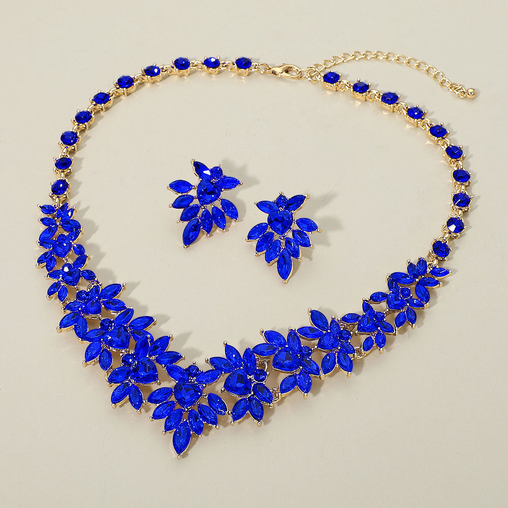 Sapphire (royal blue) marquise floral statement necklace set on gold on a beige background