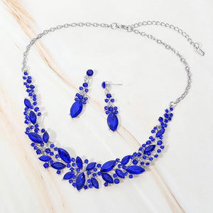 Sapphire-Royal Blue marquise stone cluster prom and evening necklace set on silver on white marble background