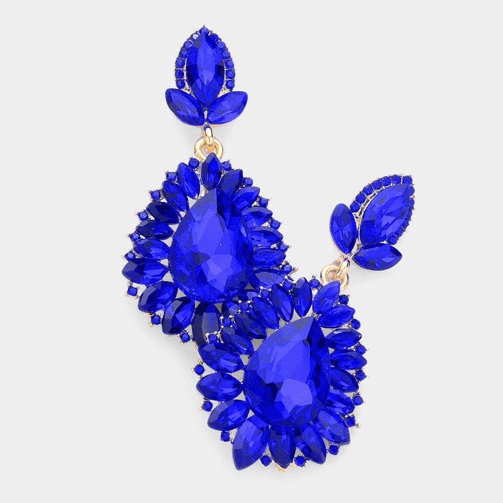 Sapphire royal blue teardrop marquise crystal dangle earrings on gold, bold statement earrings for evening and prom wear on a white background