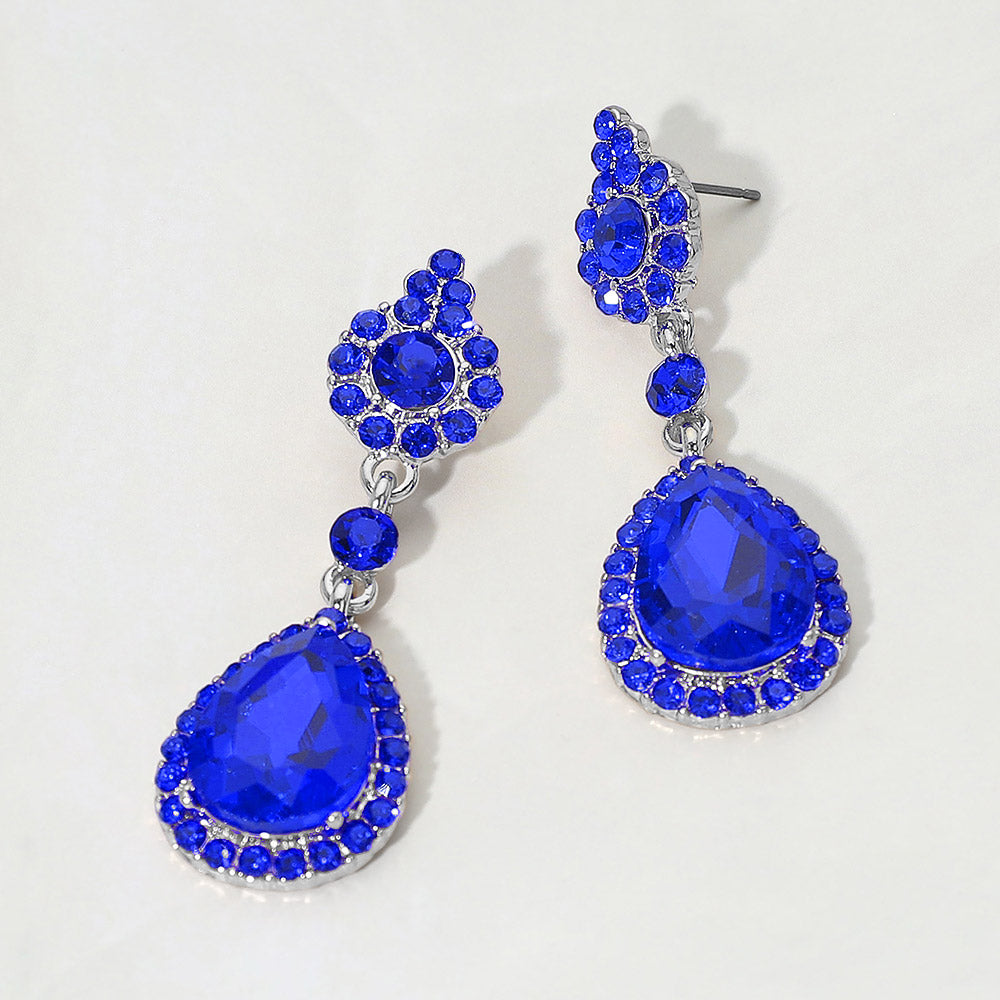 Sapphire teardrop vintage crystal drop formal and evening earrings on silver on white background