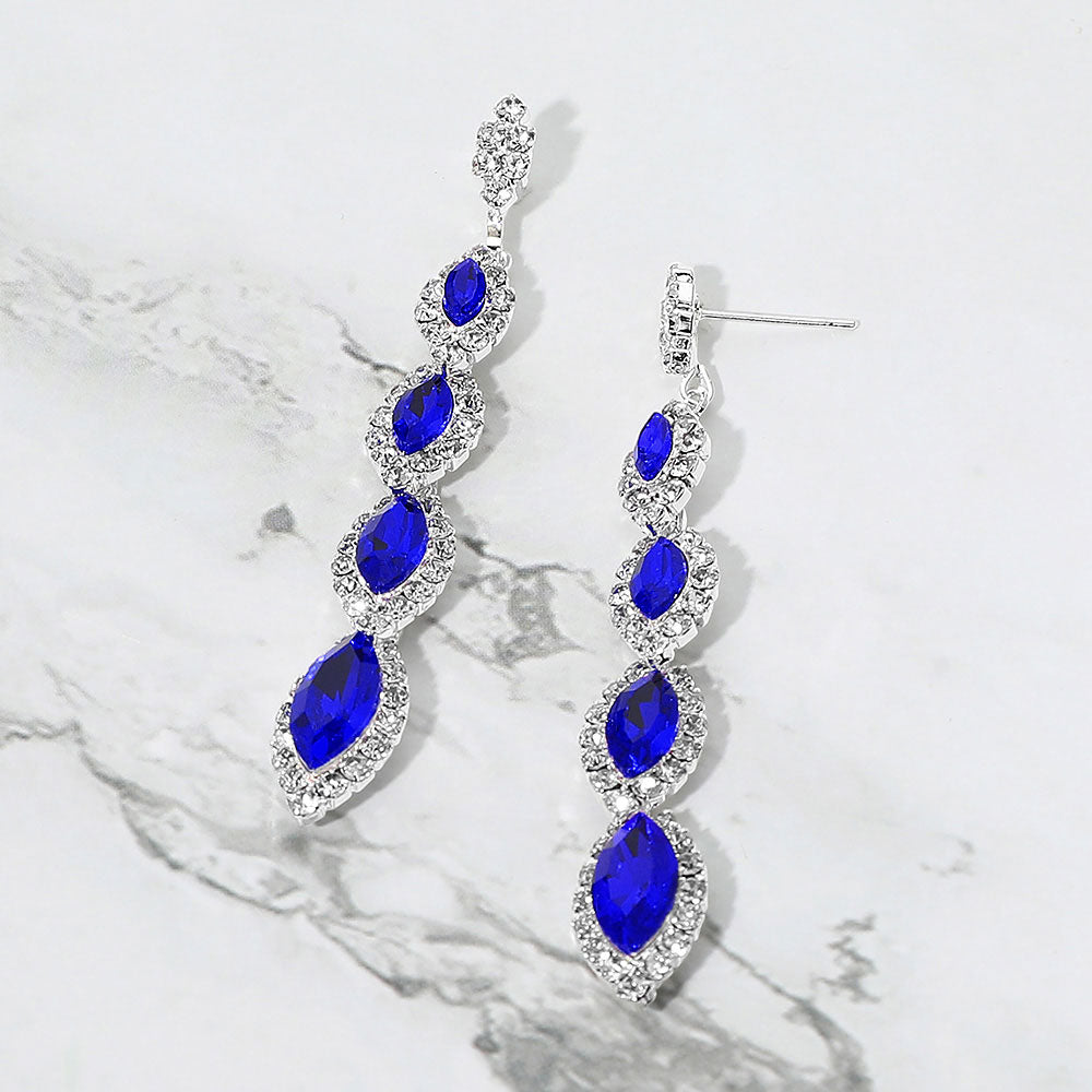 Sapphire-Royal Blue vintage marquise stone link drop formal evening earrings on silver with rhinestones on white marble background