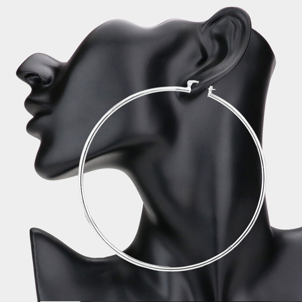 Silver Metal Hoop pin catch earrings on mannequin ear 4"