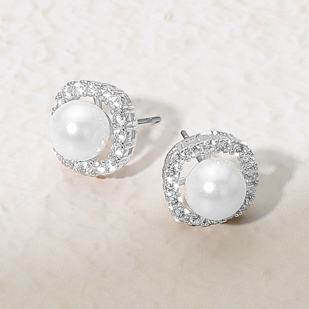 Silver Plated CZ Rhinestone Trim White Pearl Stud Earrings on Silver Bridal-Wedding-Special Occasion on a grey & white granite background