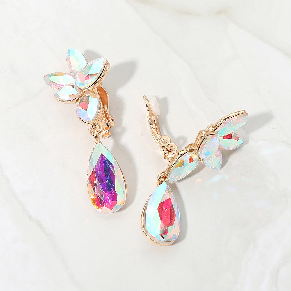 Slim AB crystal teardrop clip-on earrings on gold on white marble background