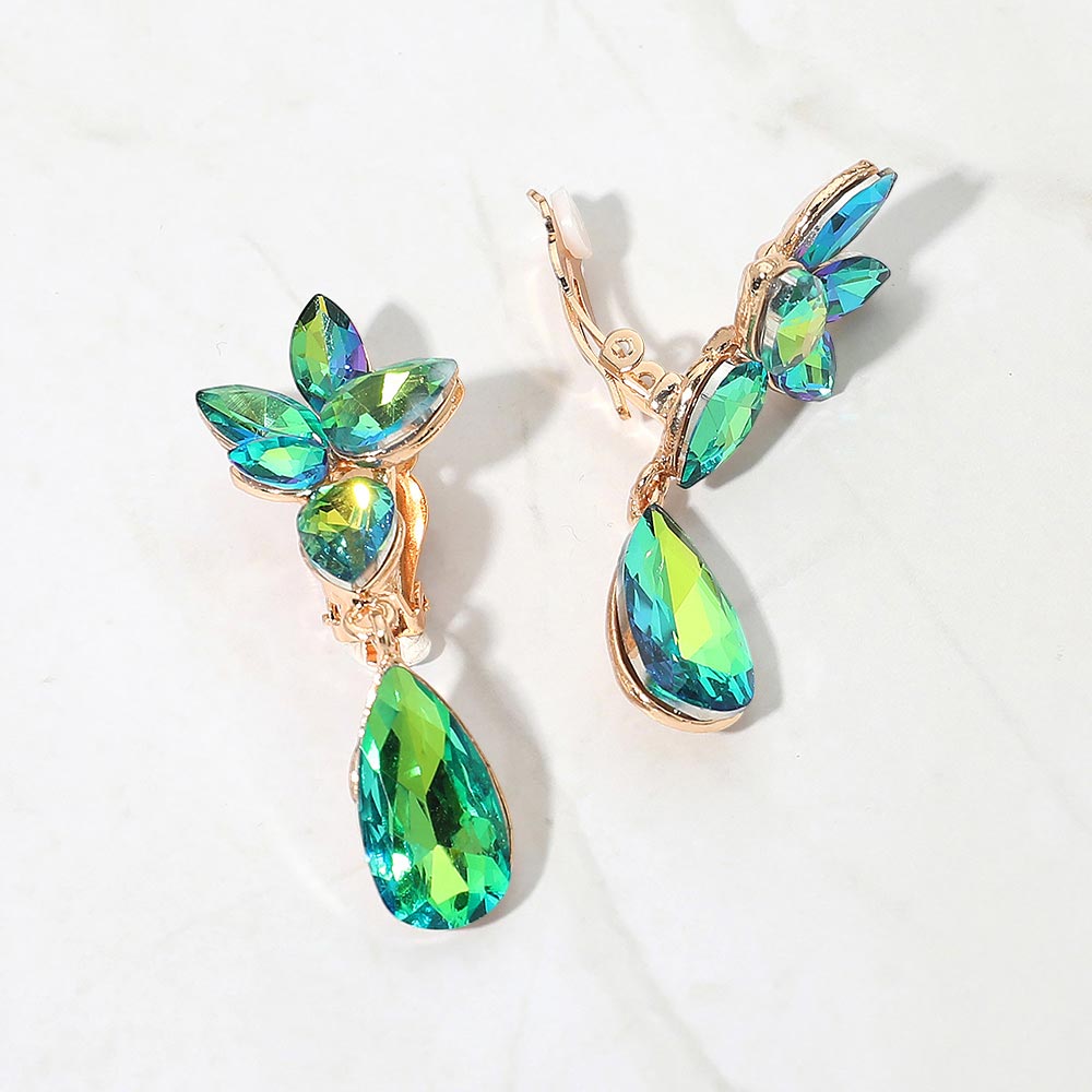 Slim Green AB crystal teardrop clip-on earrings on gold on white marble background