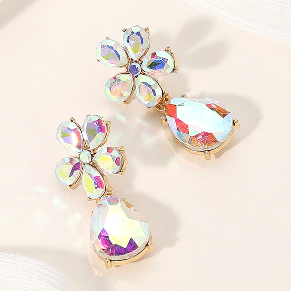 AB flower and teardrop earrings on gold-tone setting for prom, pageant, or evening wear on a cream colored background