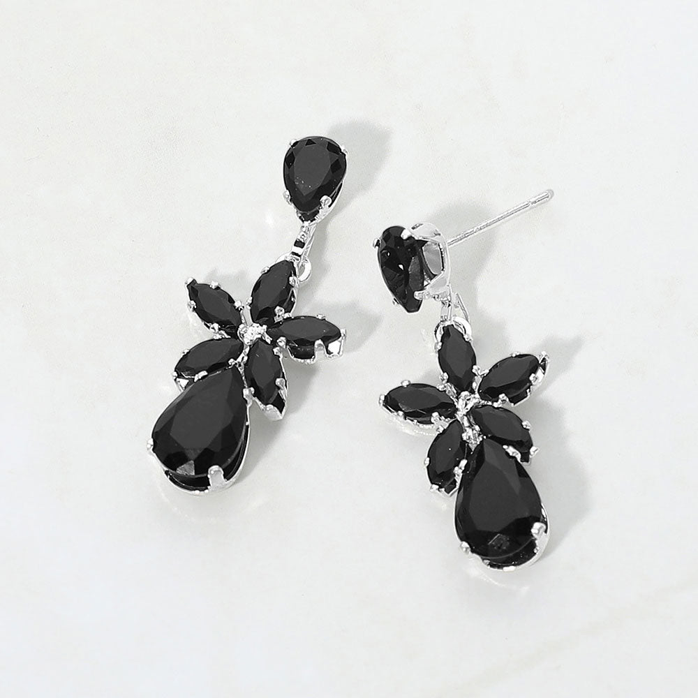 Small black crystal floral teardrop pageant earrings for little girls on silver on white background