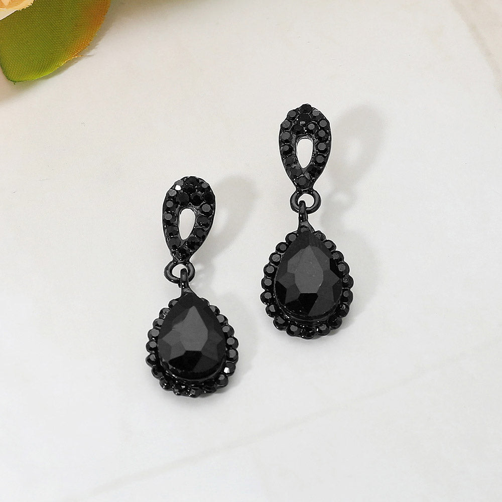 Black teardrop rhinestone earrings with faceted crystals for modern pageant or formal looks, backed in black on a white background