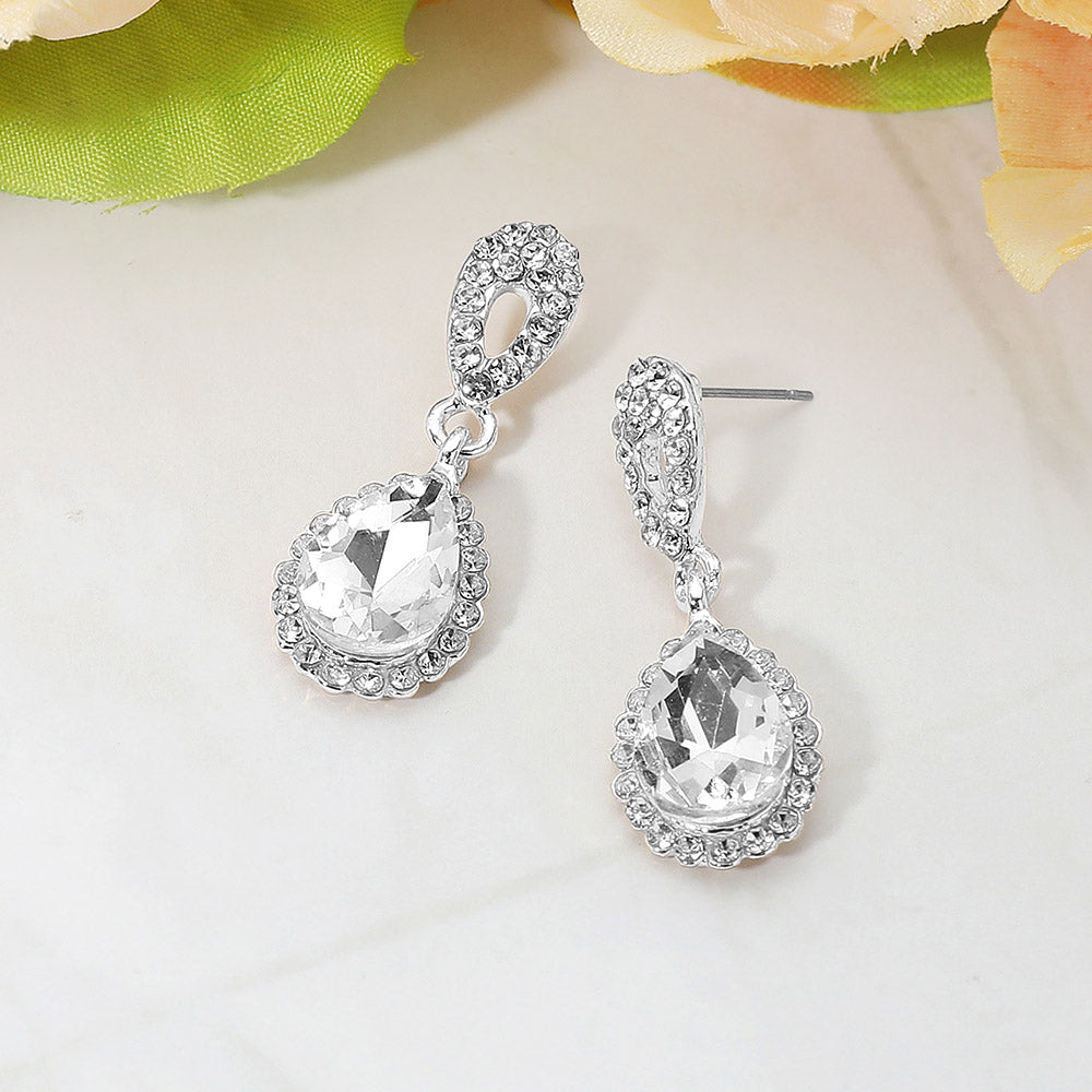 Clear teardrop rhinestone earrings silver backed, on a white background for pageant interviews, proms, or weddings