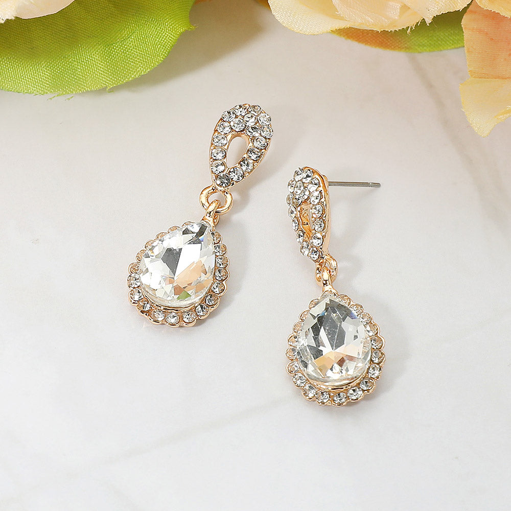 Clear and gold teardrop rhinestone earrings for formal interviews or special events backed in gold and on a white background