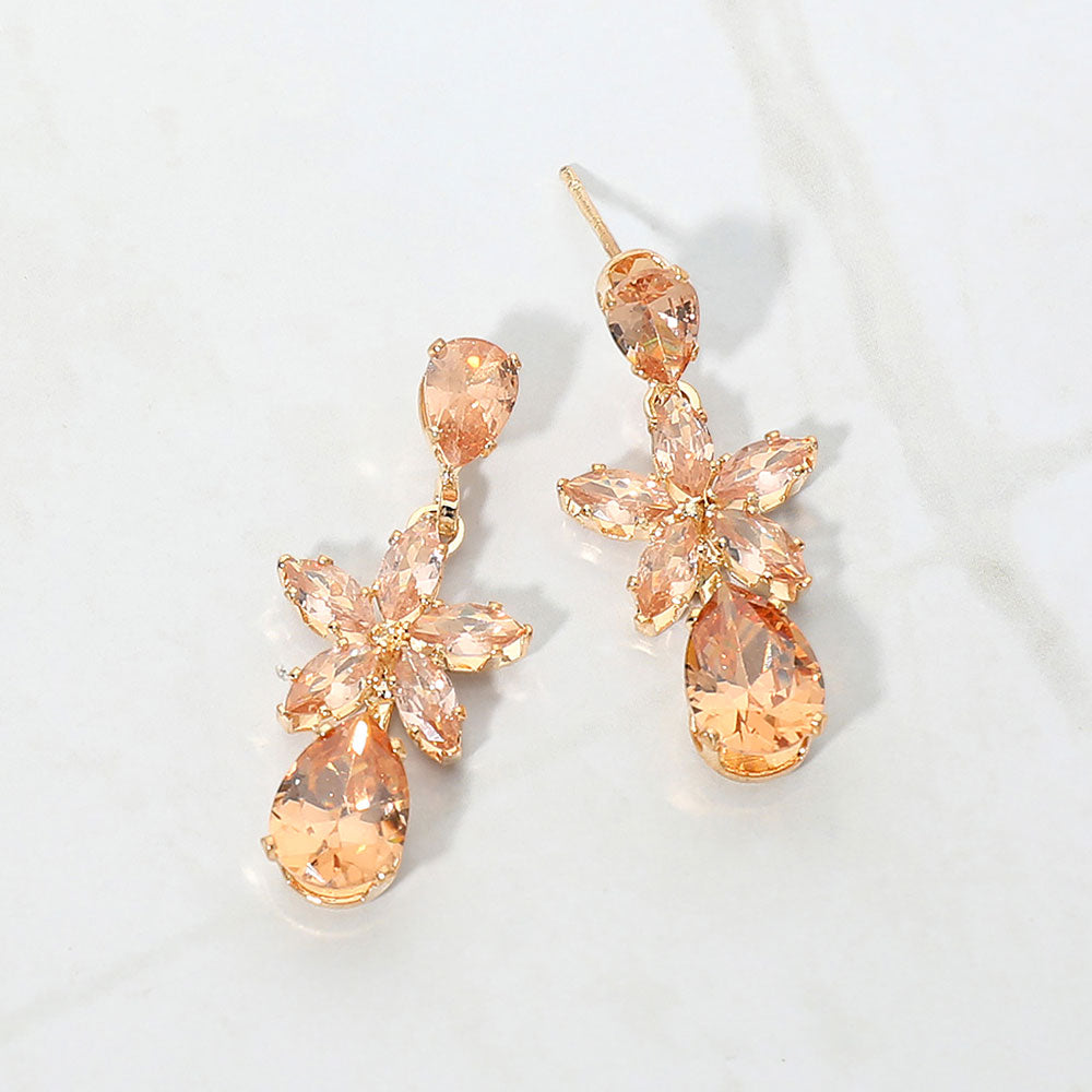 Small Gold Stone crystal floral teardrop pageant earrings for little girls on gold on white background