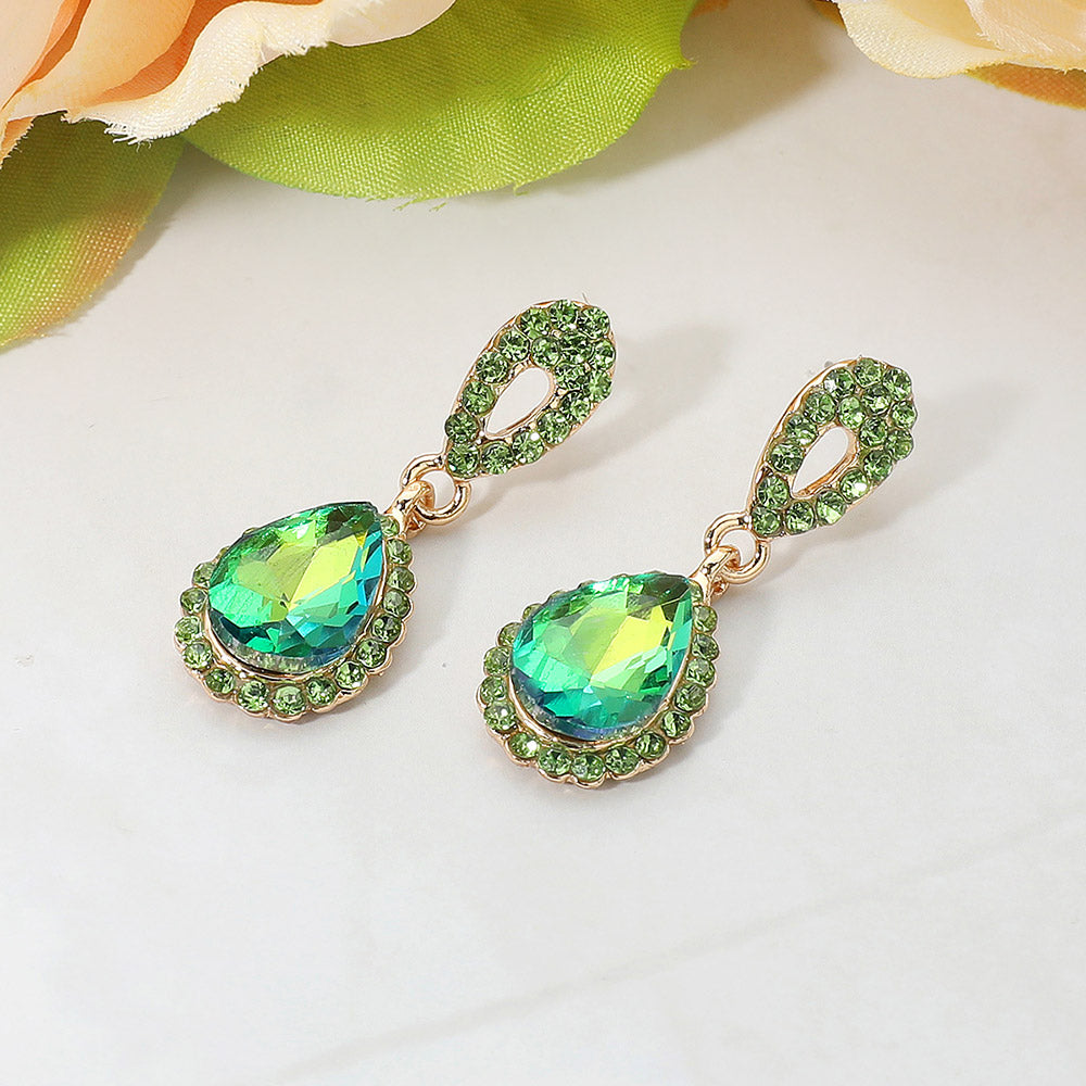 Olive green rhinestone teardrop earrings gold backed and on a white background for pageant interviews or seasonal events