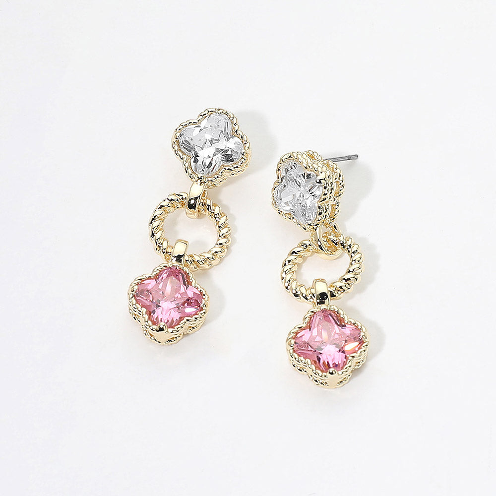 Small pink and clear crystal drop earrings on gold featuring a clear round crystal above a vintage-inspired pink cushion-shaped crystal with delicate beaded detailing, displayed on a white jewelry card.