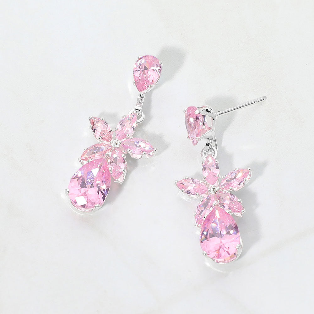 Small pink crystal floral teardrop pageant earrings for little girls on silver on white background
