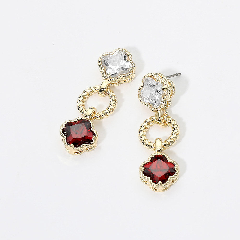 Small red and clear crystal drop earrings on gold featuring a clear round crystal above a vintage-inspired red cushion-shaped crystal with delicate beaded detailing, displayed on a white jewelry card.