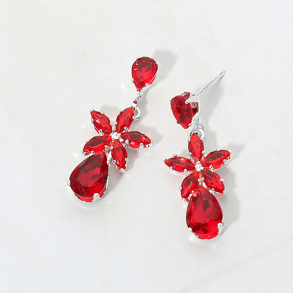 Small red crystal floral teardrop pageant earrings for little girls on silver on white background