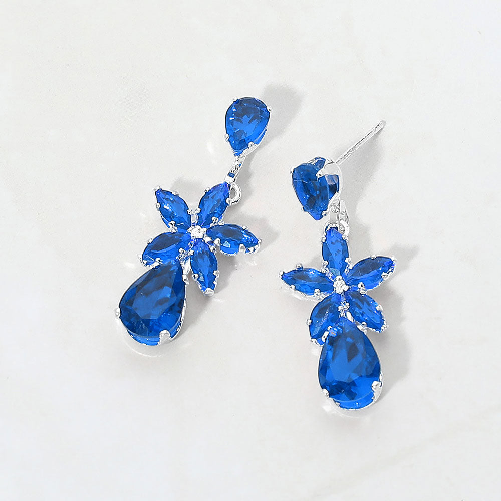 Small Sapphire crystal floral teardrop pageant earrings for little girls on silver on white background