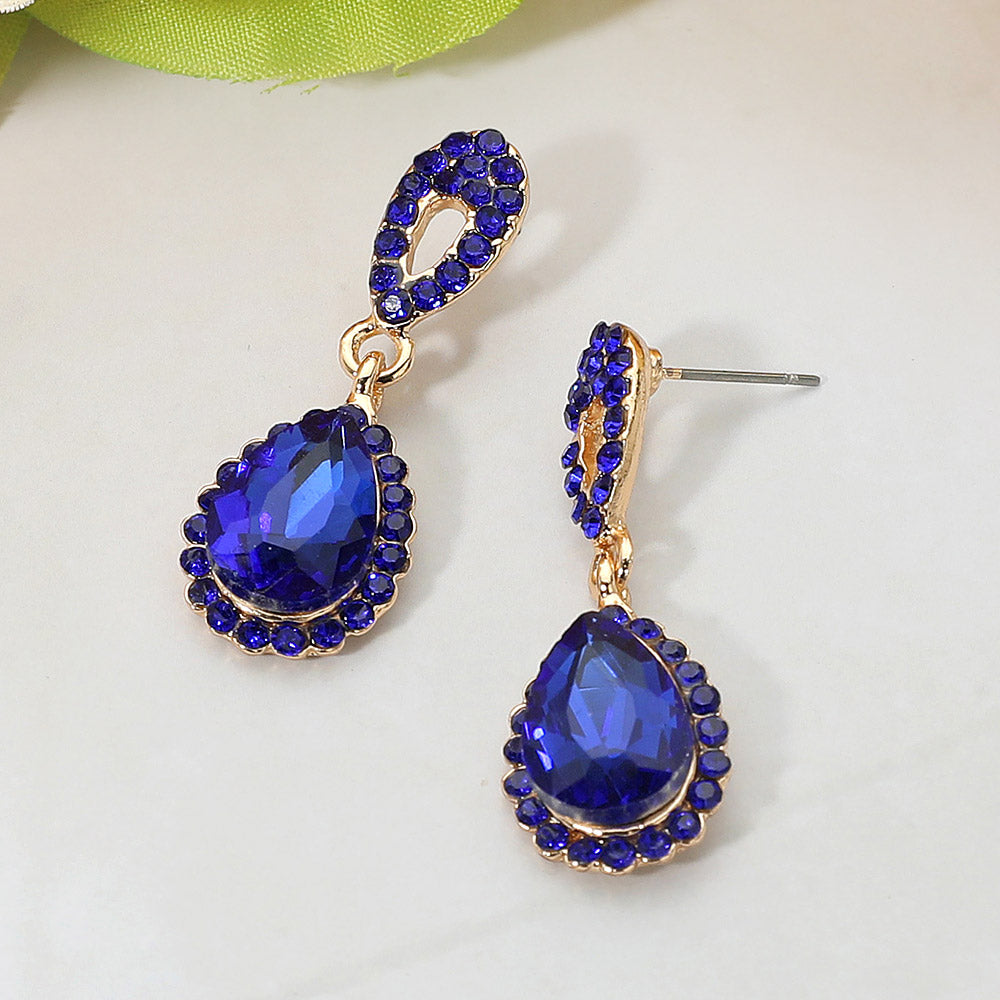 Small sapphire teardrop crystal dangle earrings with rhinestone oval links gold backed for pageants, interviews, or formal events