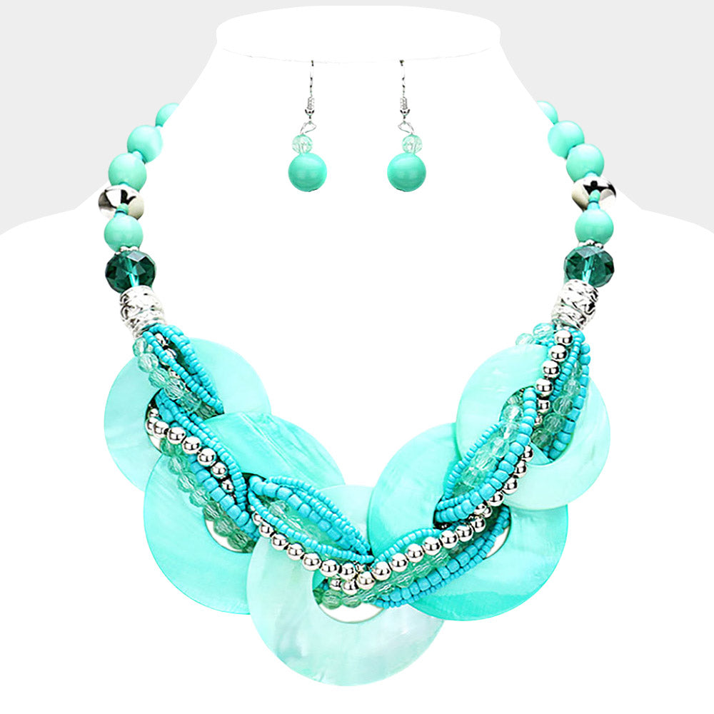 Teal chunky round link statement necklace set with matching earrings on white bust