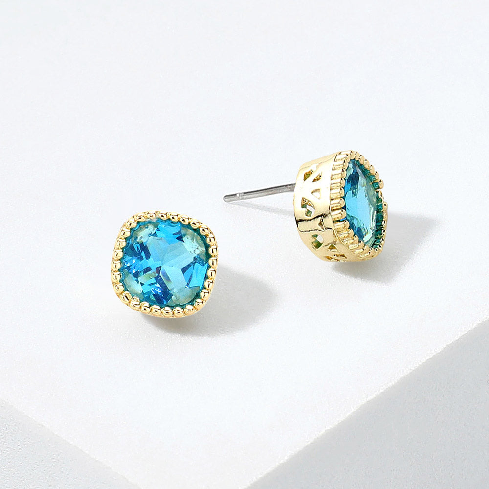 Teal square crystal stud earrings on gold displayed on a white background.