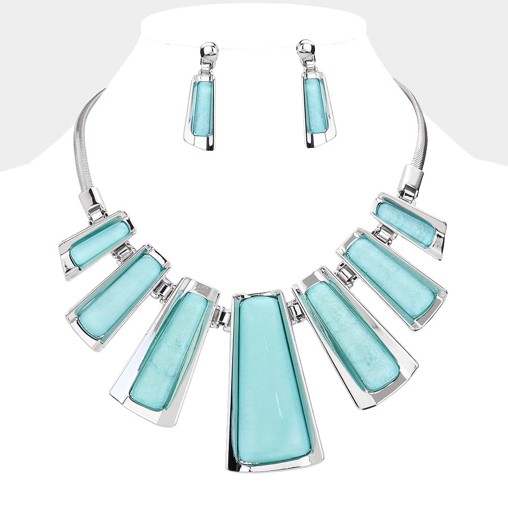 Turquoise Enamel Bar Metal statement necklace with matching earrings on a white mannequin bust