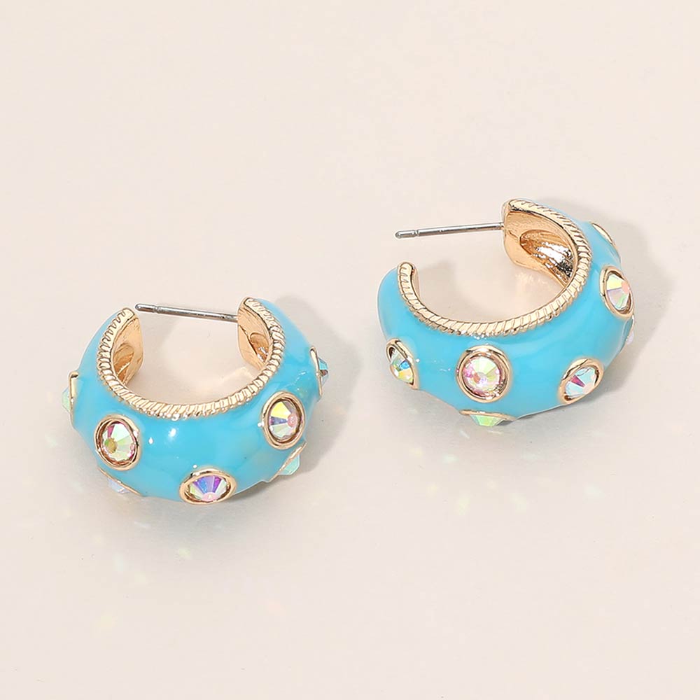 Turquoise enamel huggie hoop earrings with AB stones 1 inch size shown on a beige background
