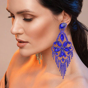 Very large royal blue sapphire crystal flower fringe pageant earrings on gold shown on a black mannequin ear