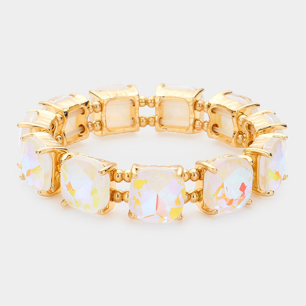 White cushion square stone stretch evening bracelet on gold on white background