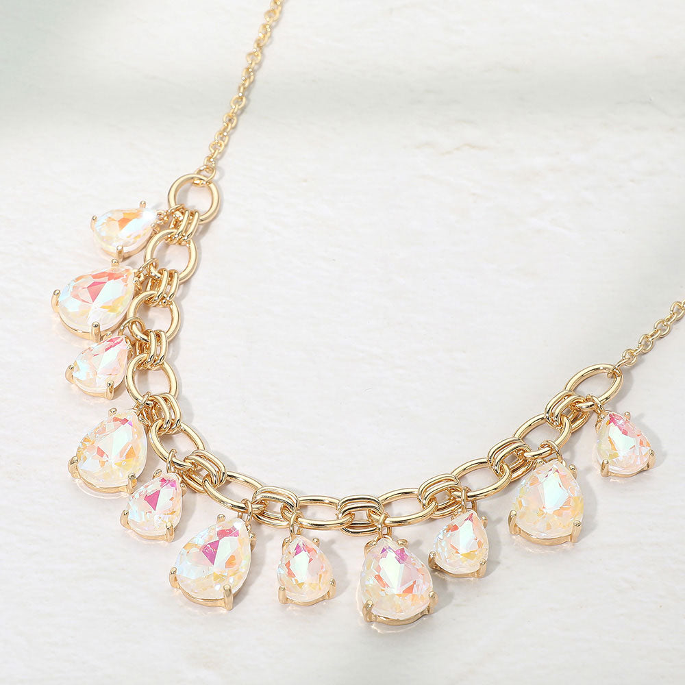White AB crystal teardrop statement necklace on gold on white background