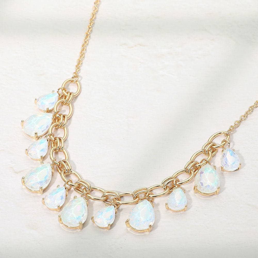 White opal crystal teardrop statement necklace on gold on white background