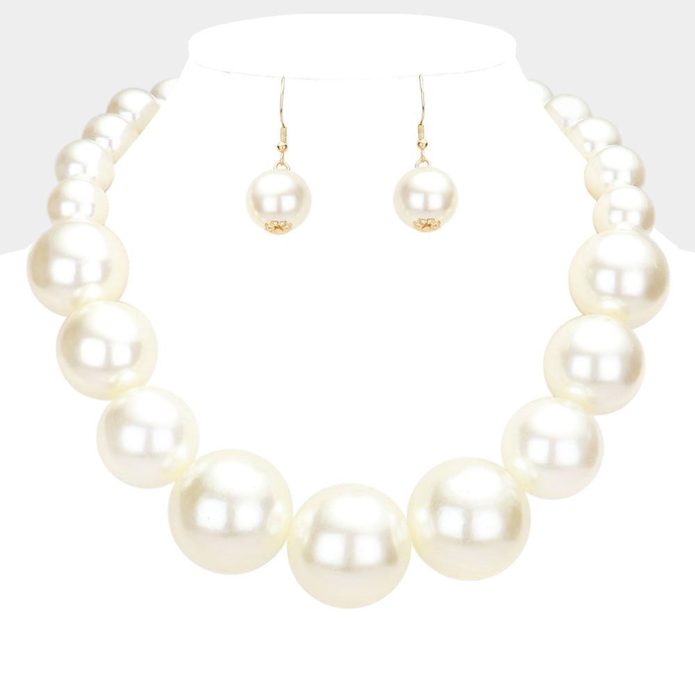 White Oversized Graduated Pearl Glossy Statement Necklace Set on silver on a white background.